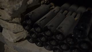 old-wine-bottles-nestled-in-dust-in-the-winery-cellar_bsfpfv9axe_thumbnail-small01